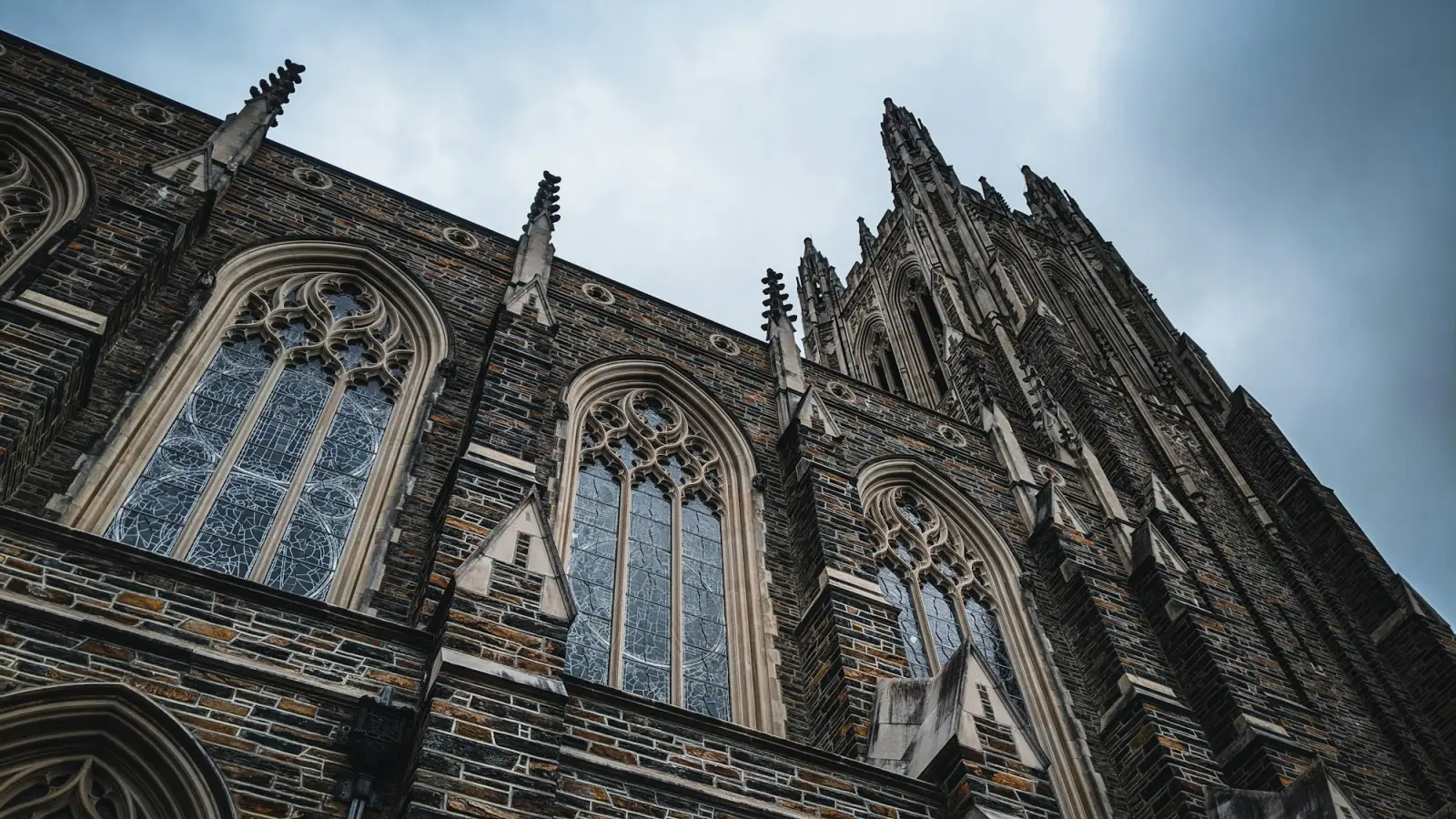 The carved stone facade of a collegiate gothic building